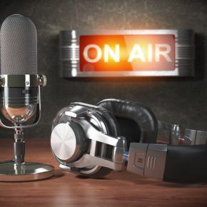 microphone and headphones in radio studio on air.