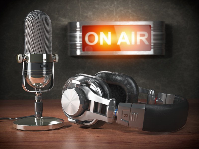 microphone and headphones in radio studio on air.