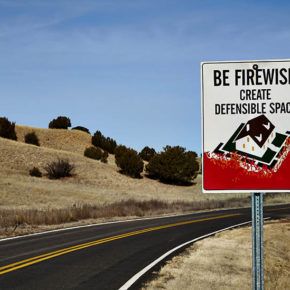 Road sign for wildfire defensible space